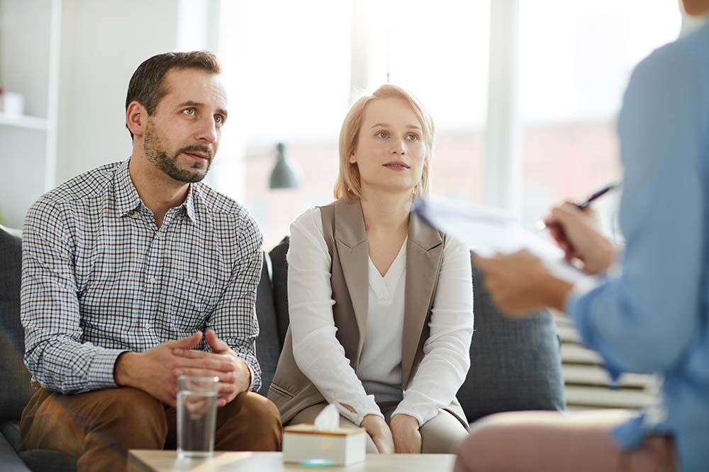 Couples Counselling couple talking to a third person